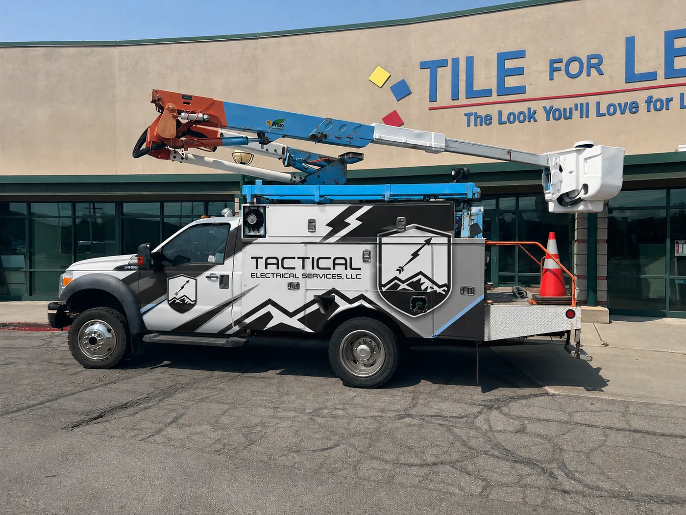 Tactical Electrical Services truck at a commercial job site