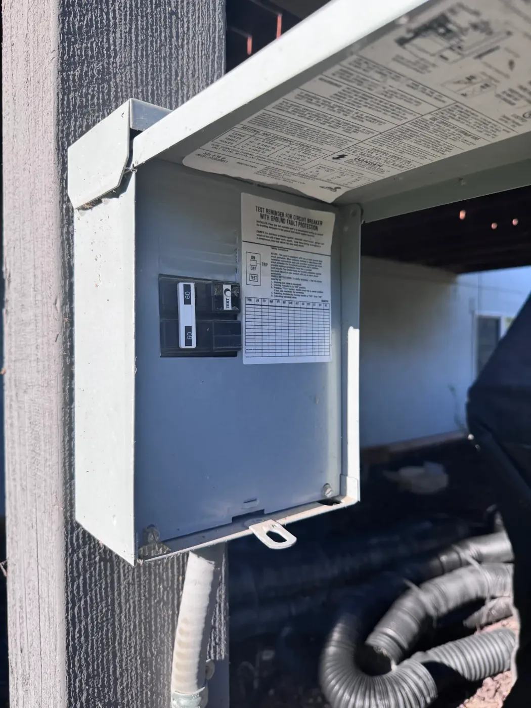Two 60A GFCI breakers inside a hot tub disconnect wired for a residential spa