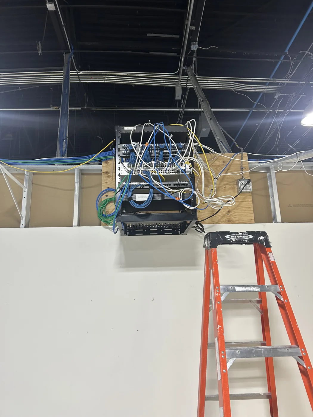 Low-voltage and data rack installed during a commercial tenant improvement