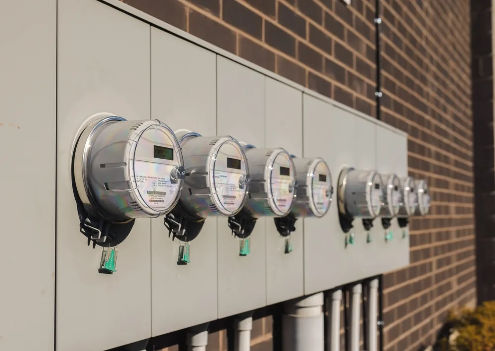 Bank of electric meters on a multi-family building served by Tactical Electrical Services