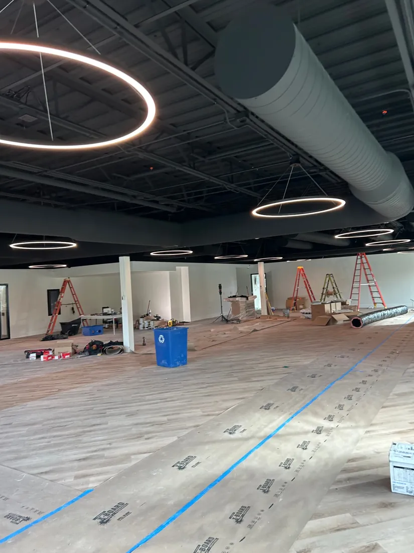 Ring pendant lighting installed during a commercial build-out