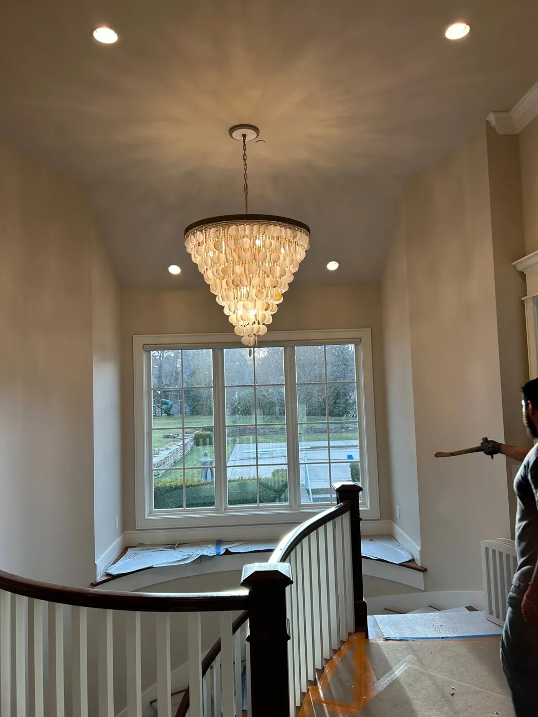 Chandelier installed over a stairwell in a Salt Lake City home