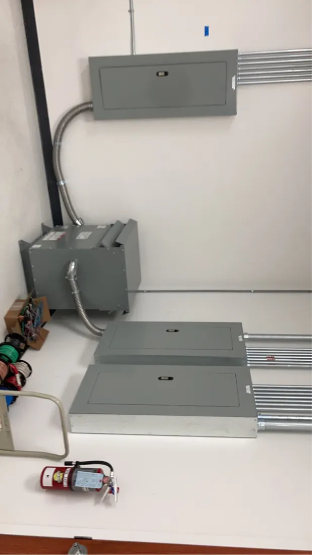 New subpanels and transformer installed in a commercial electrical room