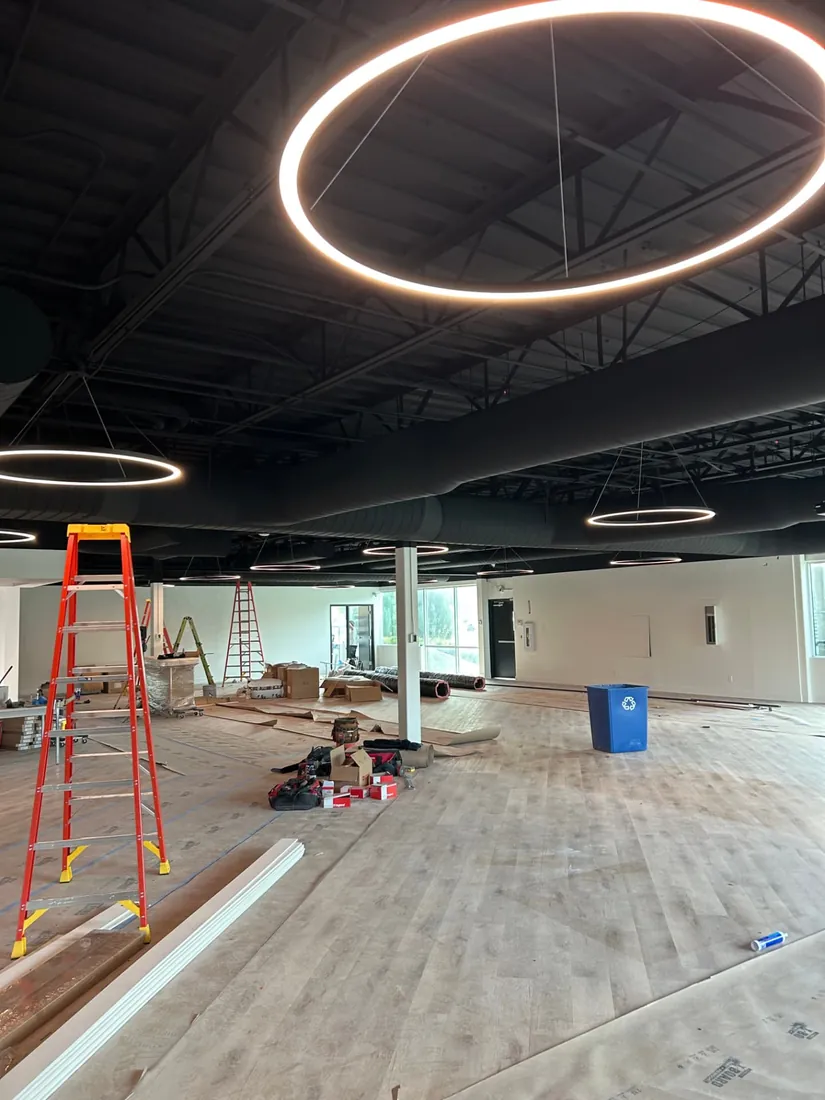 Commercial tenant improvement build-out with new ring pendant lighting installed Commercial tenant improvement build-out with new ring pendant lighting installed